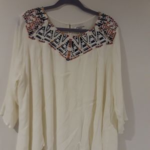 White flowy top with rainbow stitched collar